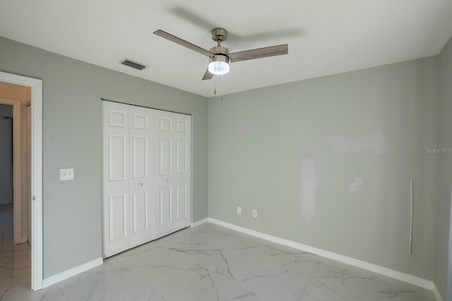 unfurnished bedroom with a closet and ceiling fan