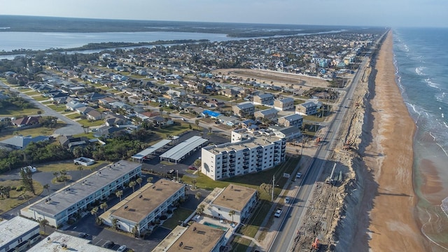 aerial view featuring a water view and a view of the beach