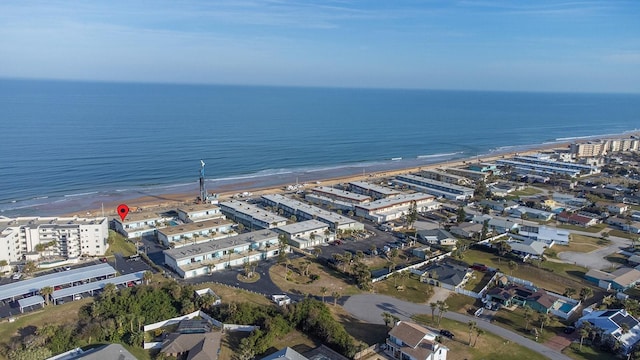 drone / aerial view with a view of city, a beach view, and a water view