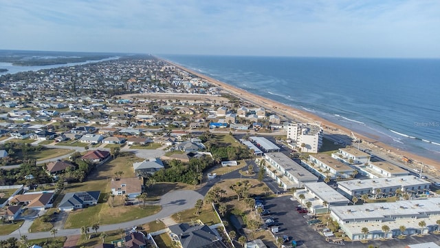 aerial view with a water view and a view of the beach