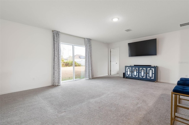 unfurnished living room featuring carpet floors