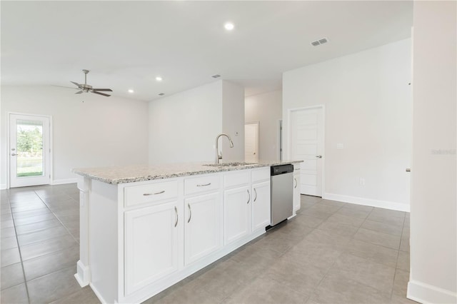 kitchen featuring white cabinetry, sink, stainless steel dishwasher, and a center island with sink