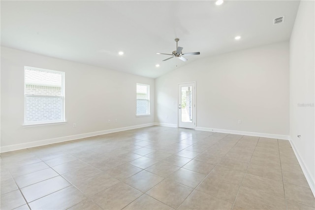 tiled spare room with ceiling fan and lofted ceiling