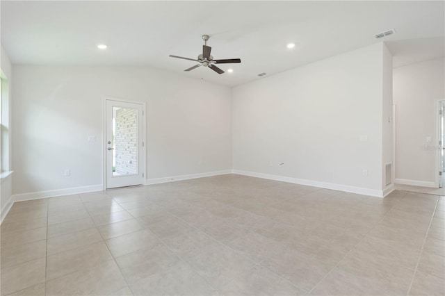 spare room with light tile patterned flooring, ceiling fan, and lofted ceiling