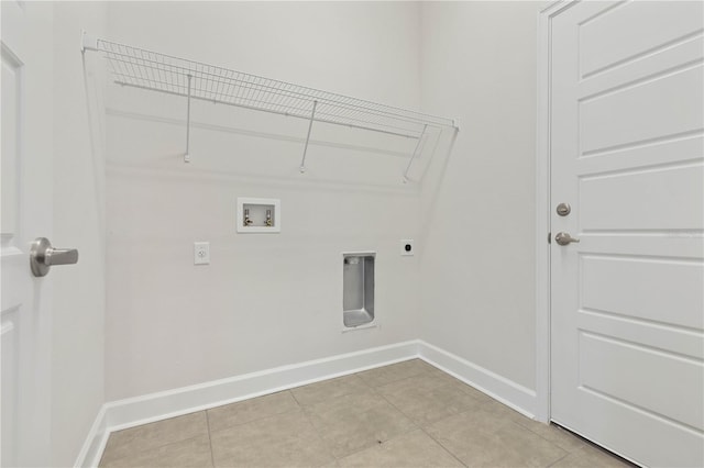 clothes washing area with hookup for a washing machine, light tile patterned flooring, and electric dryer hookup