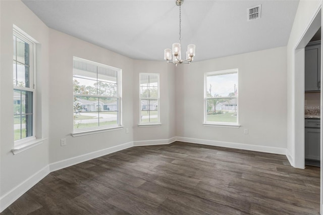 7 Whitcock Ln, Palm Coast, FL 32164 - unfurnished dining area featuring a chandelier, dark wood-style flooring, baseboards, and vaulted ceiling