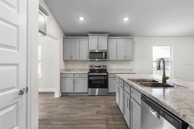 7 Whitcock Ln, Palm Coast, FL 32164 - kitchen featuring appliances with stainless steel finishes, gray cabinets, a sink, recessed lighting, and dark wood-style flooring