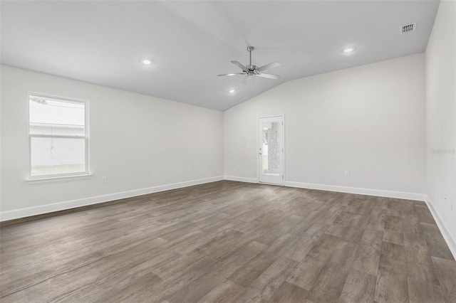 7 Whitcock Ln, Palm Coast, FL 32164 - spare room with ceiling fan, vaulted ceiling, dark wood-style floors, baseboards, and recessed lighting