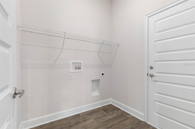 7 Whitcock Ln, Palm Coast, FL 32164 - washroom featuring washer hookup, dark wood-type flooring, hookup for an electric dryer, and baseboards