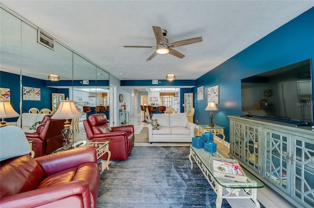 living room featuring ceiling fan