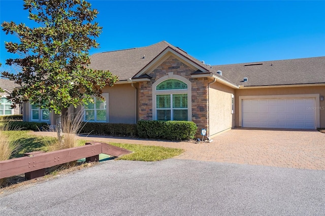 ranch-style home featuring a garage