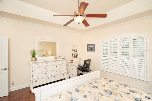 bedroom featuring crown molding, dark wood-type flooring, and ceiling fan