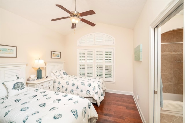 bedroom with vaulted ceiling, ceiling fan, and dark hardwood / wood-style flooring