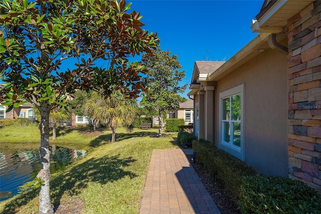 view of yard featuring a water view