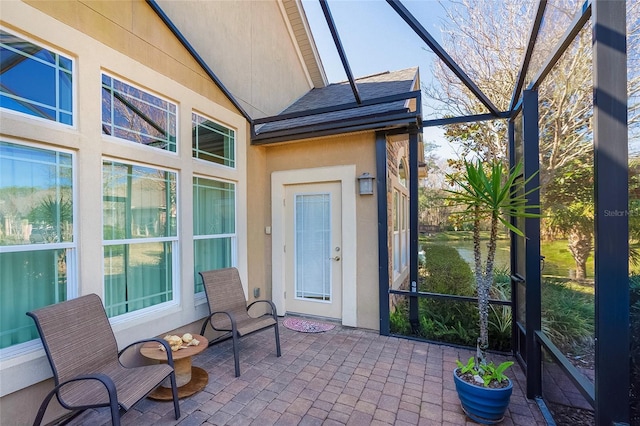 unfurnished sunroom with vaulted ceiling