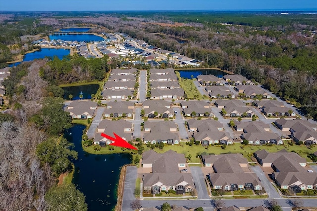 birds eye view of property featuring a water view