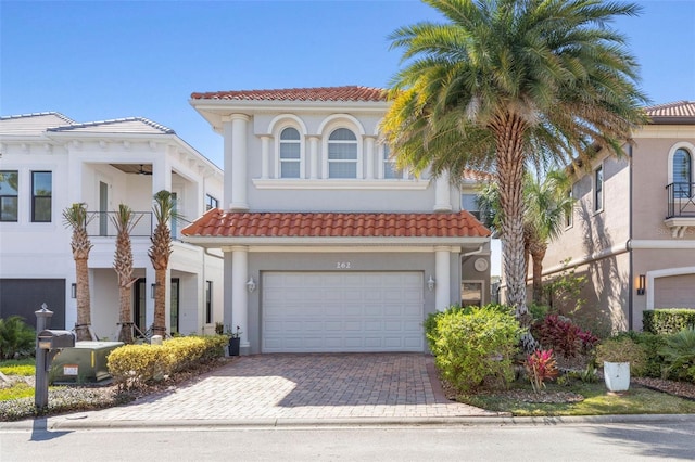 mediterranean / spanish house featuring a garage