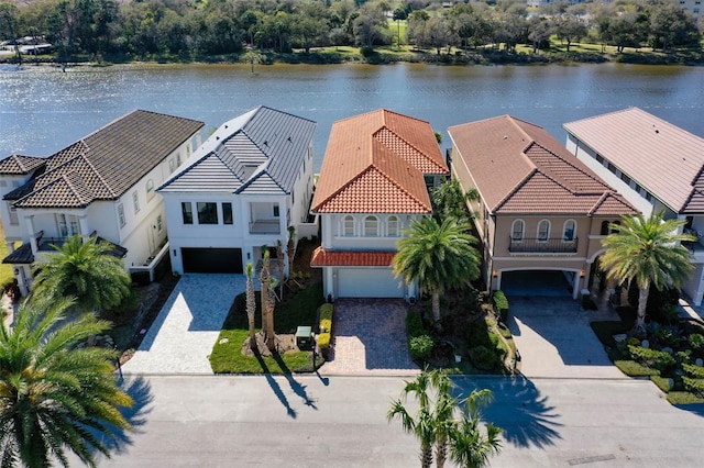 bird's eye view with a residential view and a water view