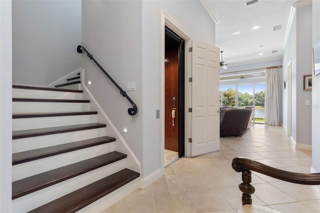 stairway featuring baseboards, recessed lighting, tile patterned flooring, and crown molding