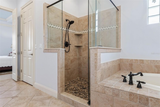 bathroom featuring ensuite bathroom, a bath, and walk in shower