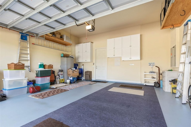 garage featuring a garage door opener and electric panel