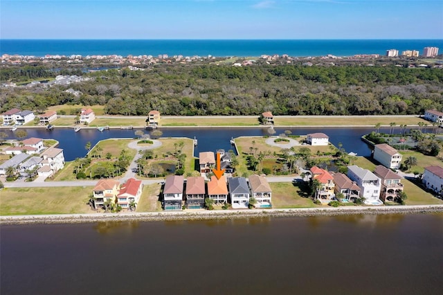 drone / aerial view featuring a water view and a residential view