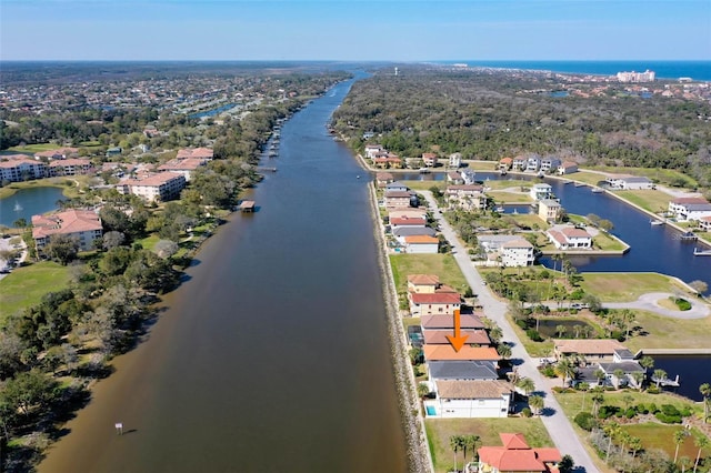 drone / aerial view with a residential view and a water view