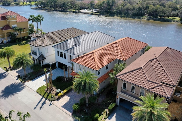 birds eye view of property with a water view