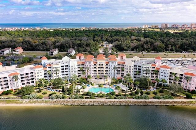 birds eye view of property with a water view