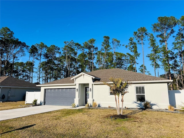 ranch-style home featuring a garage and a front yard