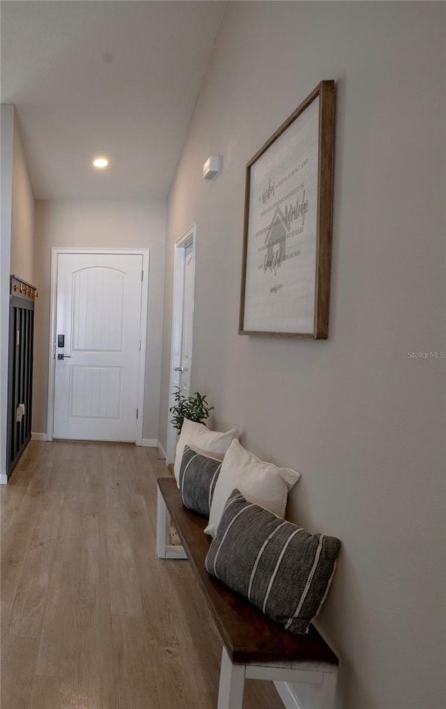 hallway with light hardwood / wood-style flooring