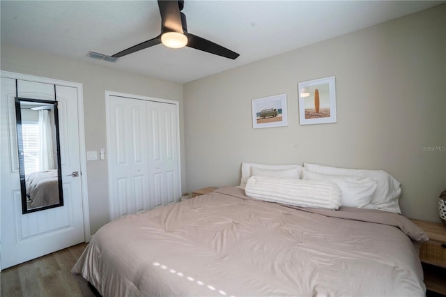 bedroom with hardwood / wood-style floors and ceiling fan