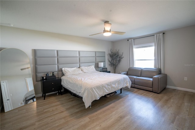 bedroom featuring hardwood / wood-style floors and ceiling fan