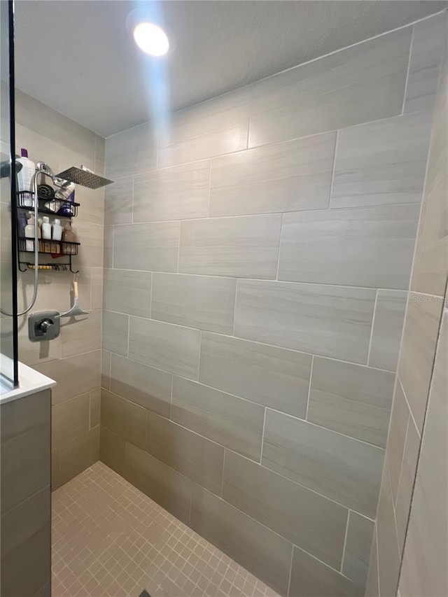 bathroom with a tile shower