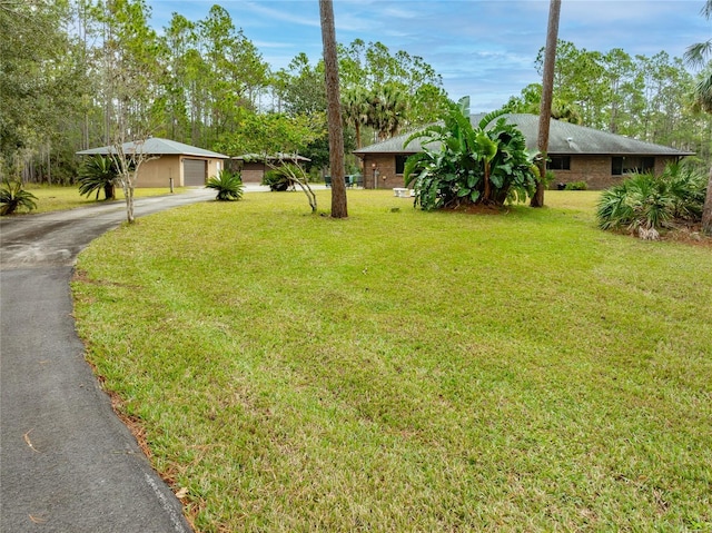 view of yard with a garage