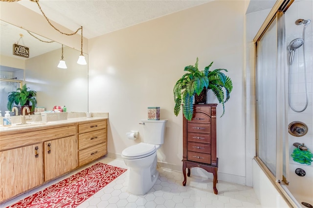 full bathroom featuring shower / bath combination with glass door, tile patterned flooring, vanity, toilet, and a textured ceiling