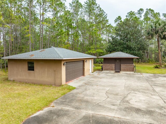 garage featuring a yard