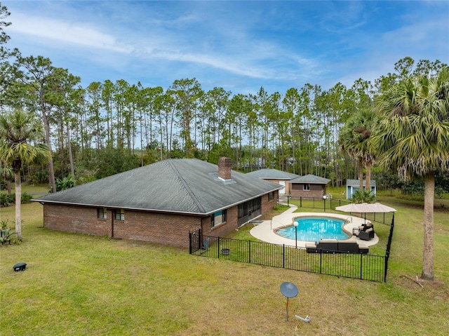 view of pool featuring a patio and a lawn