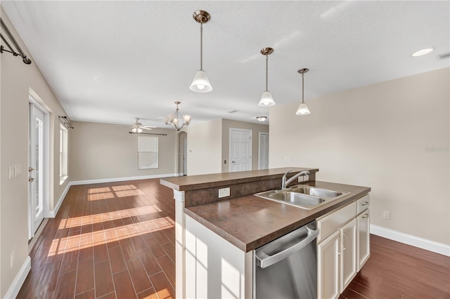 kitchen with sink, white cabinetry, hanging light fixtures, an island with sink, and stainless steel dishwasher