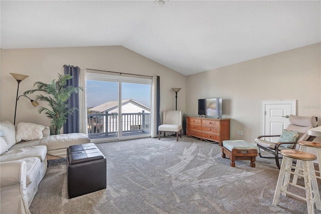 carpeted living room with vaulted ceiling