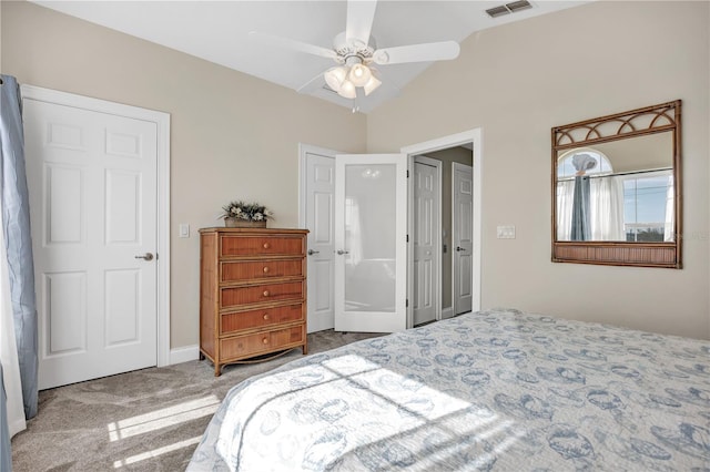 bedroom with ceiling fan, lofted ceiling, and carpet