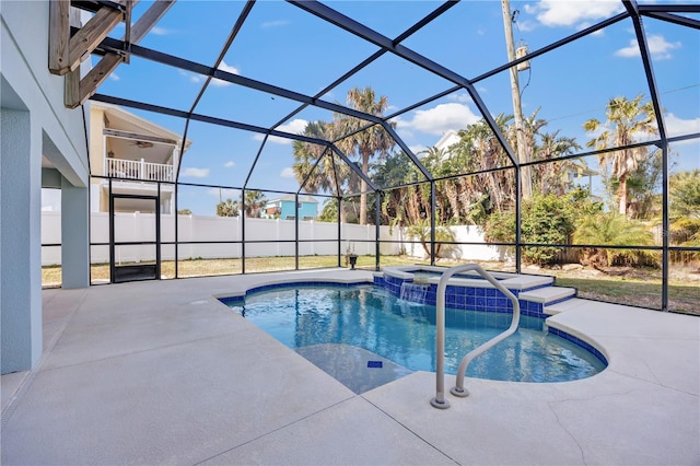 view of pool featuring a patio area, an in ground hot tub, ceiling fan, and glass enclosure