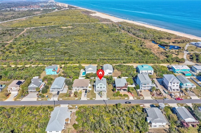 aerial view with a view of the beach and a water view