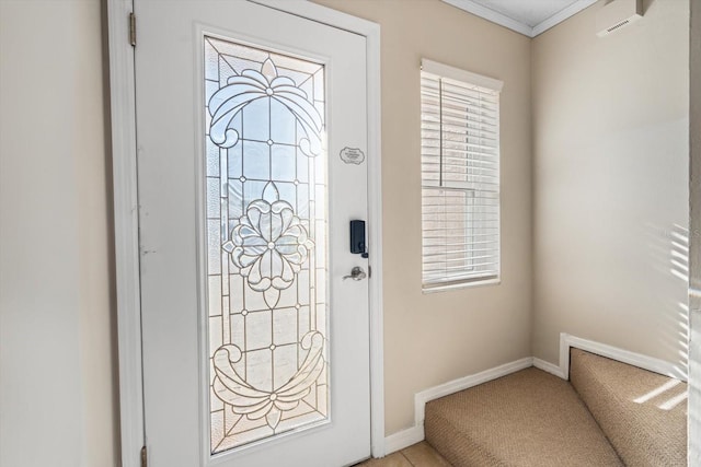 foyer entrance featuring crown molding