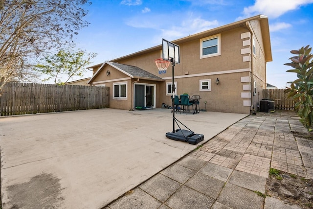 back of property featuring cooling unit and a patio area