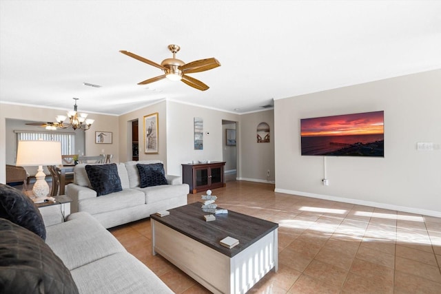 living room featuring tile patterned flooring, crown molding, and ceiling fan with notable chandelier