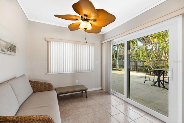 interior space with crown molding, ceiling fan, and light tile patterned floors