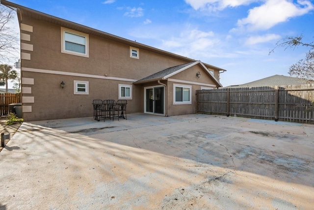 back of property featuring a patio area