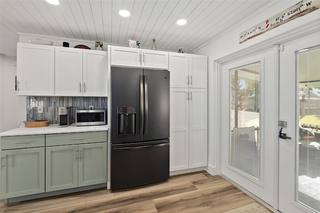 kitchen with white cabinetry, backsplash, wood ceiling, light hardwood / wood-style floors, and black refrigerator with ice dispenser