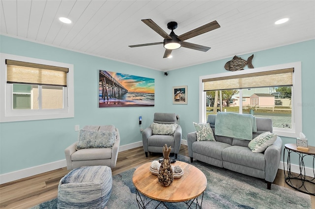 living room with hardwood / wood-style floors, wood ceiling, and ceiling fan